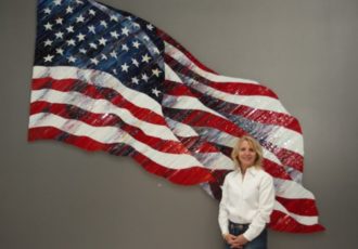 Artist Terri Albanese with her artwork "Colors of Courage" Glass, 107" x 72" x 2". See her portfolio by visiting www.ArtsyShark.com