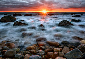 "Sunrise Over the East End" beach photograph by Rick Berk