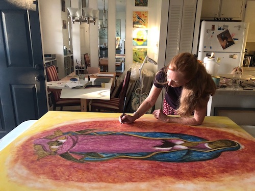 artist Christine Hales painting in studio