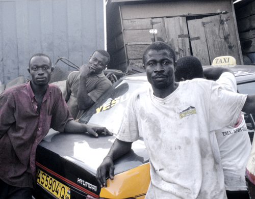 photograph of a taxi and driver in Ghana