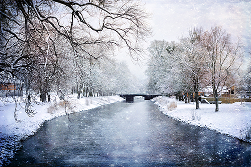 photograph of a frozen river in winter