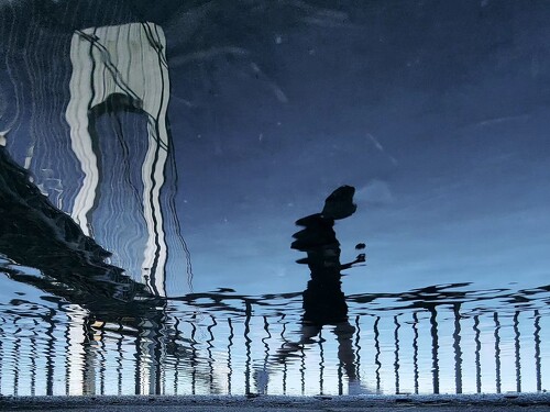 photo of a reflection of a runner in New York City