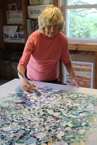 artist Barbara Krupp painting in studio