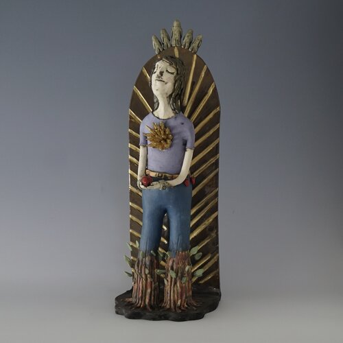 whimsical ceramic sculpture of a young woman