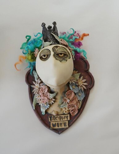 mixed media sculpture of a trophy wife