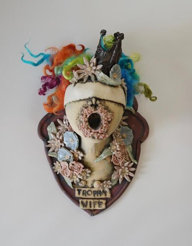 Ceramic and Wool wall sculpture of a trophy wife