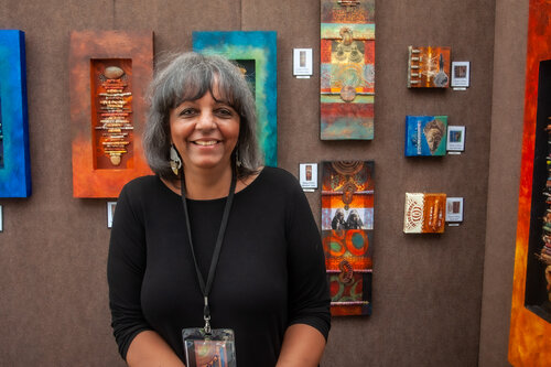 sculptor with her wall art