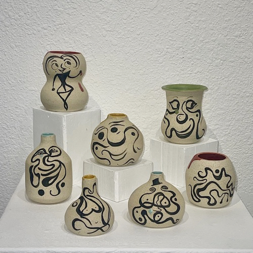 collection of handmade ceramic vases with abstract designs