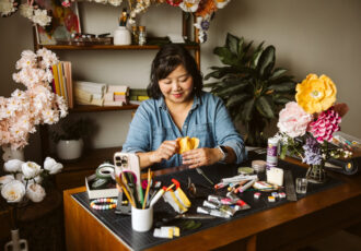 Paper artist working in her studio