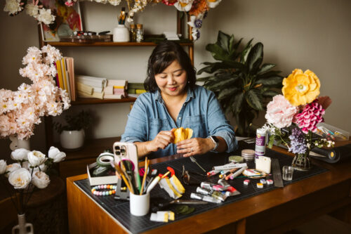 Paper artist working in her studio