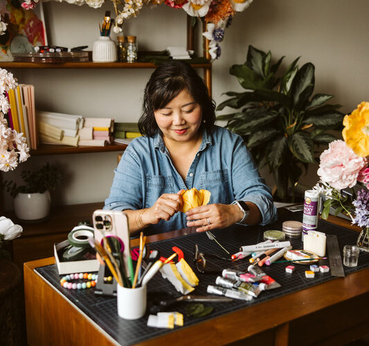 Paper artist working in her studio