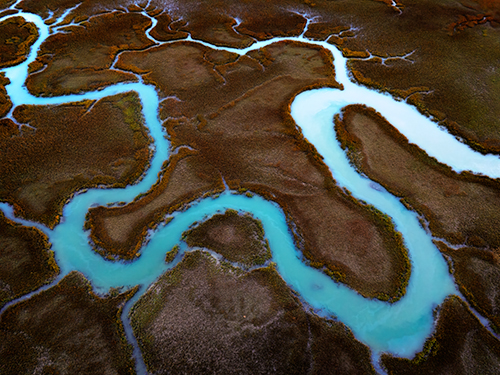 fine art photo of a meandering river in a salt marsh