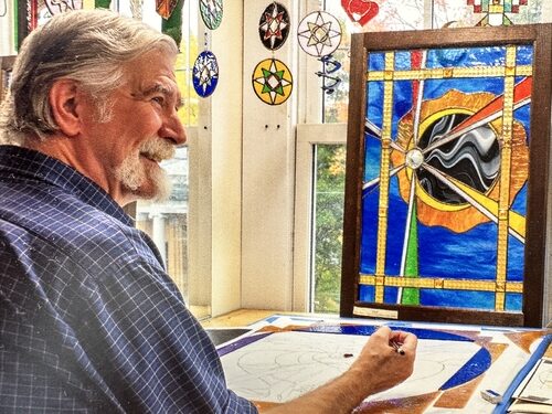 artist in a stained glass studio