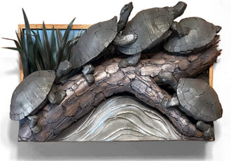 cardboard and mixed media sculpture of a group of turtles